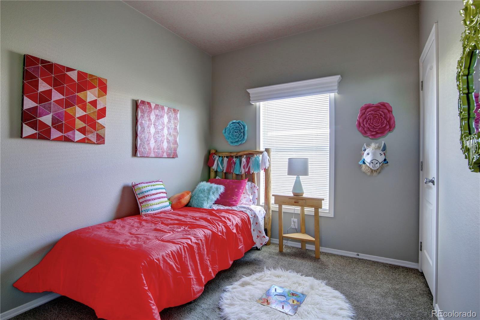 125 12th Street Fairplay, CO 80440 - Photo 13 of 17 a bedroom with a bed and a painting on the wall
