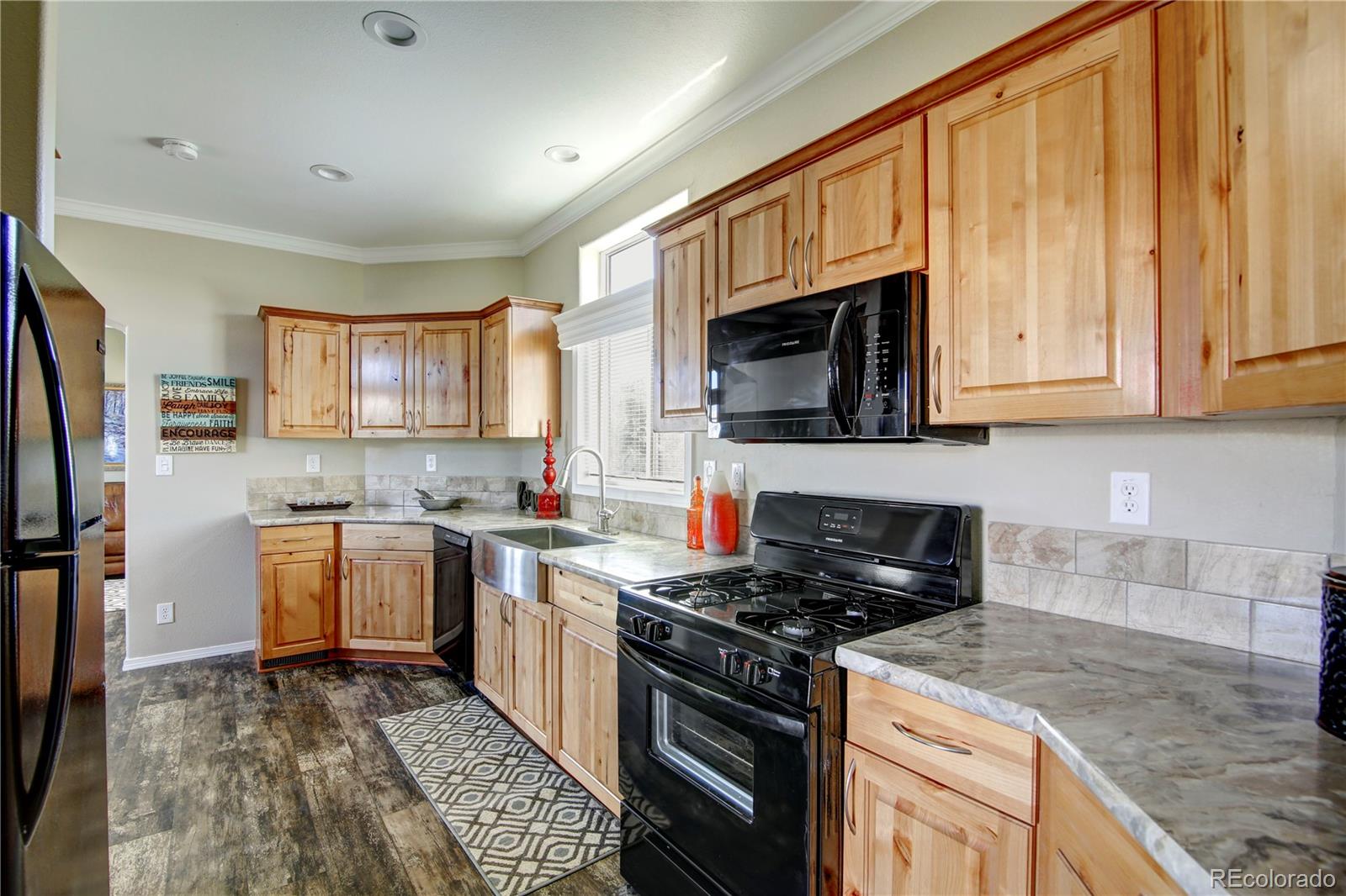 125 12th Street Fairplay, CO 80440 - Photo 5 of 17 a kitchen with stainless steel appliances granite countertop a stove sink microwave and refrigerator