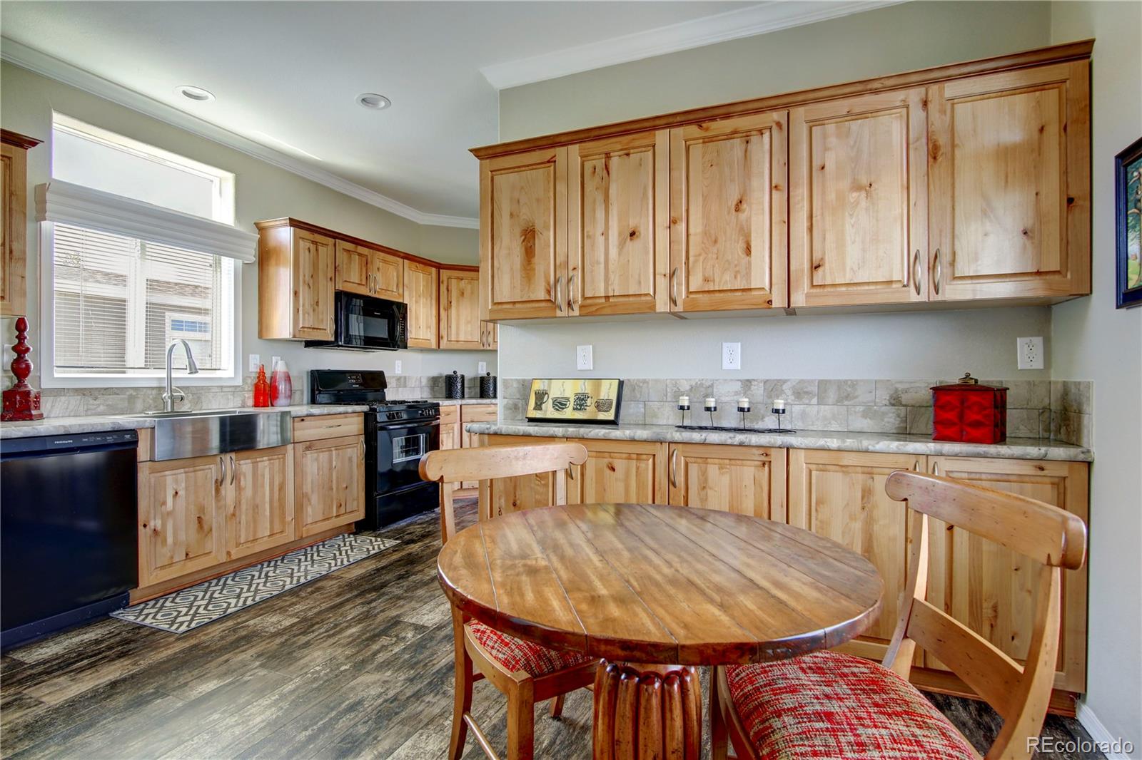 125 12th Street Fairplay, CO 80440 - Photo 6 of 17 a kitchen with stainless steel appliances granite countertop a sink a microwave refrigerator and chairs
