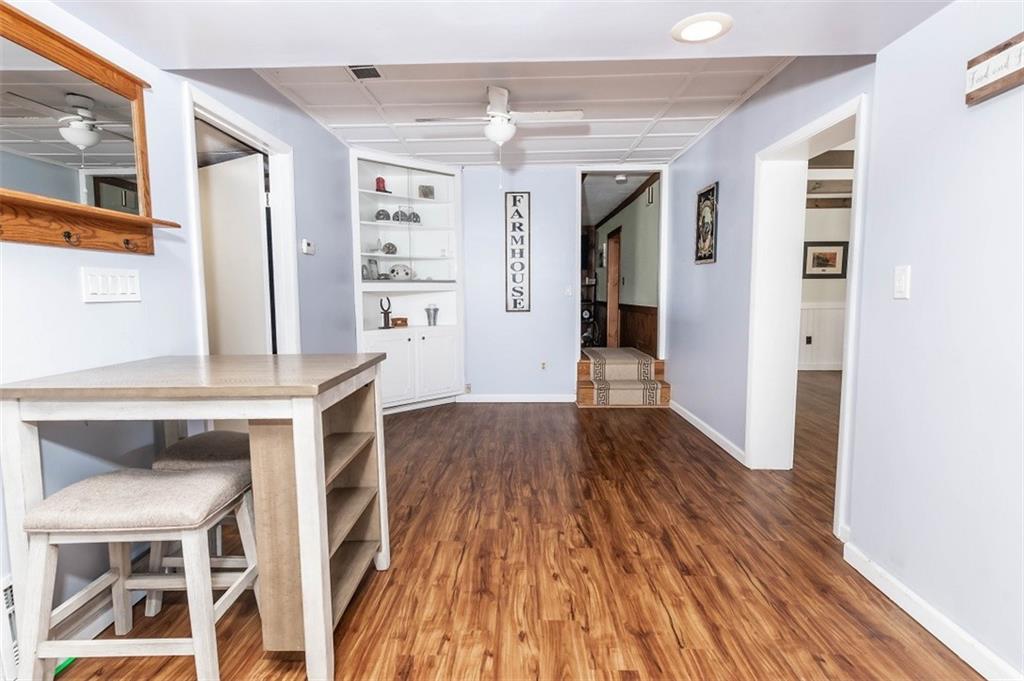 47 McMillen Road Home, PA 15747 - Photo 11 of 19 a view of a hallway and wooden floor and dining room