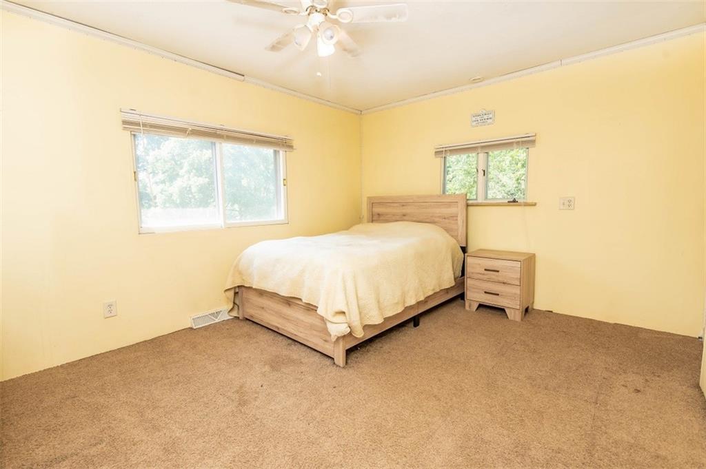 47 McMillen Road Home, PA 15747 - Photo 13 of 19 a bed sitting in a bedroom next to a window
