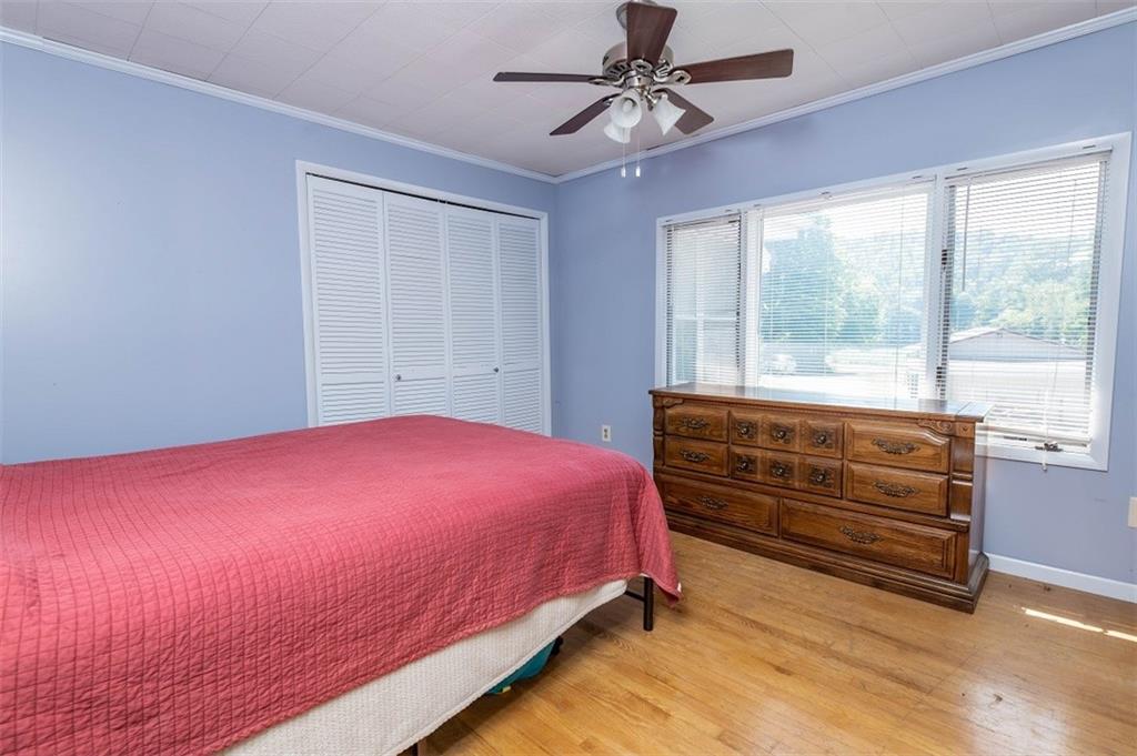 47 McMillen Road Home, PA 15747 - Photo 14 of 19 a bedroom with a bed and a large window