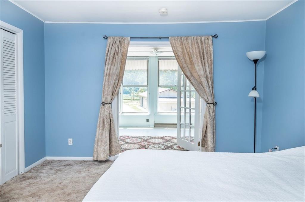 47 McMillen Road Home, PA 15747 - Photo 16 of 19 a bedroom with a bed and a large window