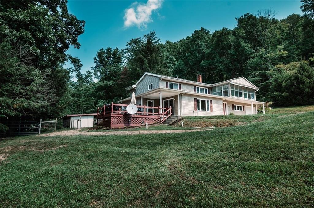 47 McMillen Road Home, PA 15747 - Photo 18 of 19 a front view of a house with a garden