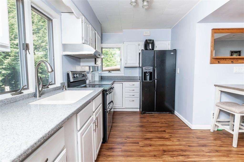 47 McMillen Road Home, PA 15747 - Photo 10 of 19 a kitchen with granite countertop a refrigerator and a sink