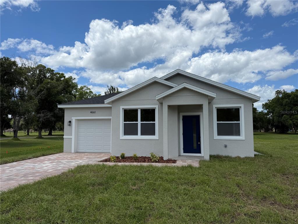 4661 Hickory Tree Road St. Cloud, FL 34772 - Photo 2 of 20 front view of house with a yard