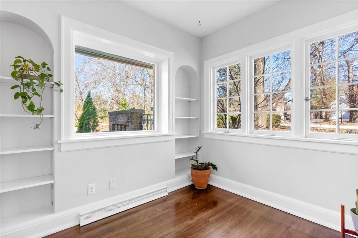 2121 South Illini Road Springfield, IL 62704 - Photo 18 of 43 a view of an empty room with a window and wooden floor