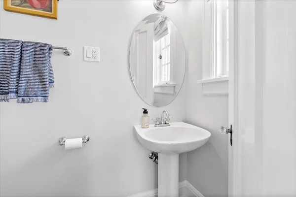 a bathroom with a sink a mirror and shower