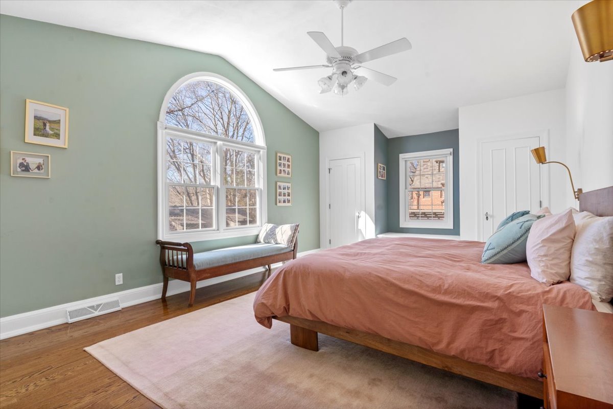 2121 South Illini Road Springfield, IL 62704 - Photo 23 of 43 a bedroom with a bed and a chandelier