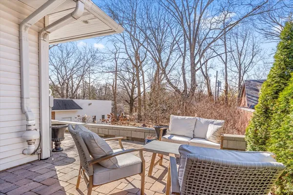 a view of patio with a table and chairs and couches