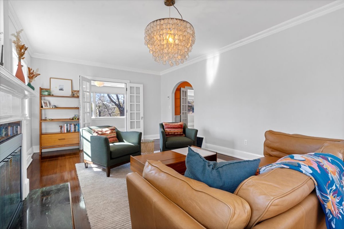 2121 South Illini Road Springfield, IL 62704 - Photo 4 of 43 a living room with furniture and a chandelier
