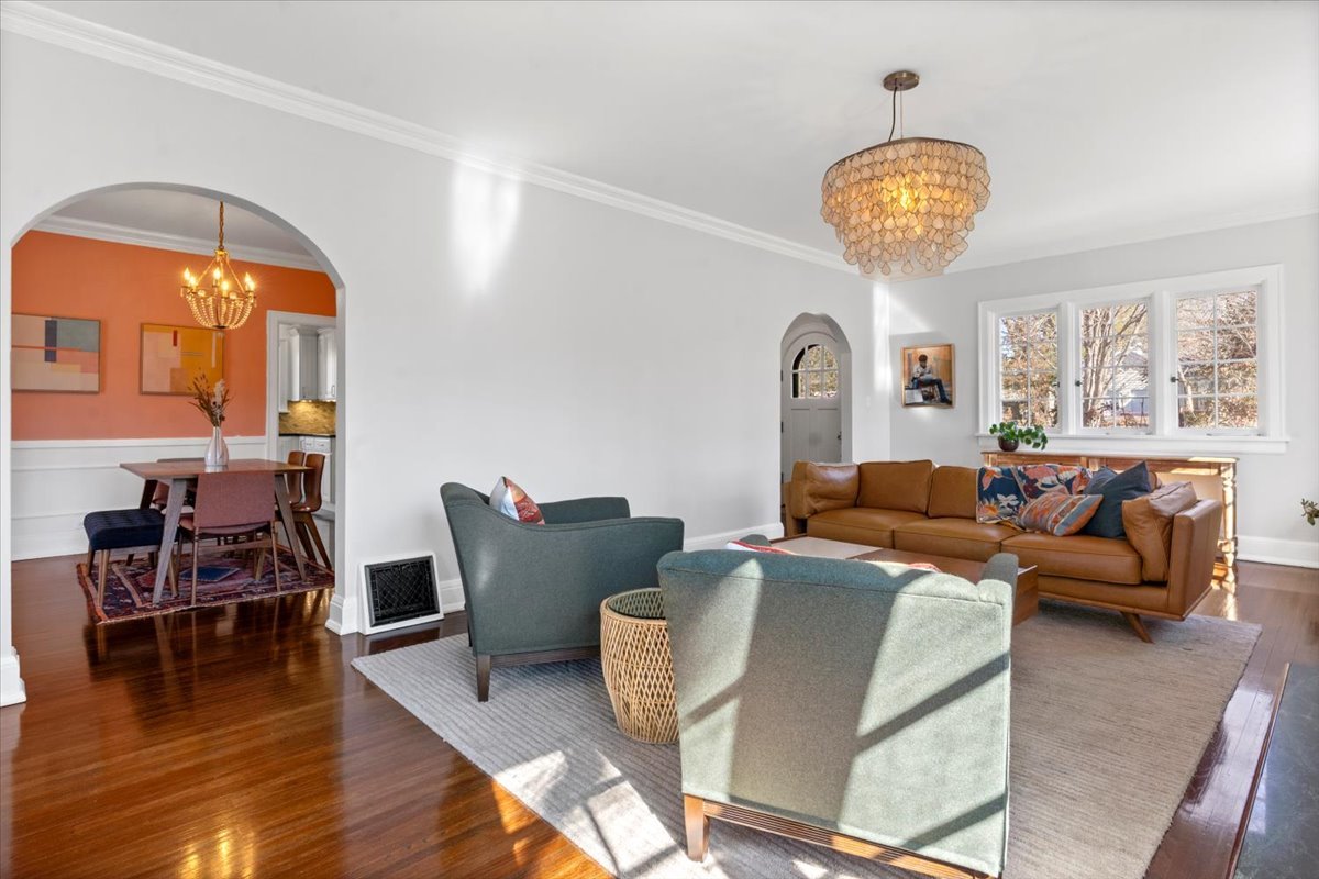2121 South Illini Road Springfield, IL 62704 - Photo 5 of 43 a living room with furniture a dining table and a chandelier