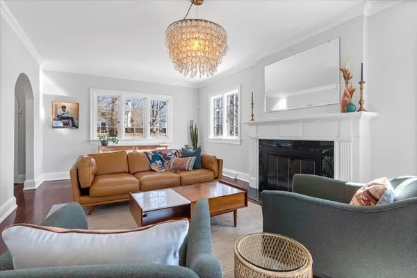 a living room with furniture and a fireplace