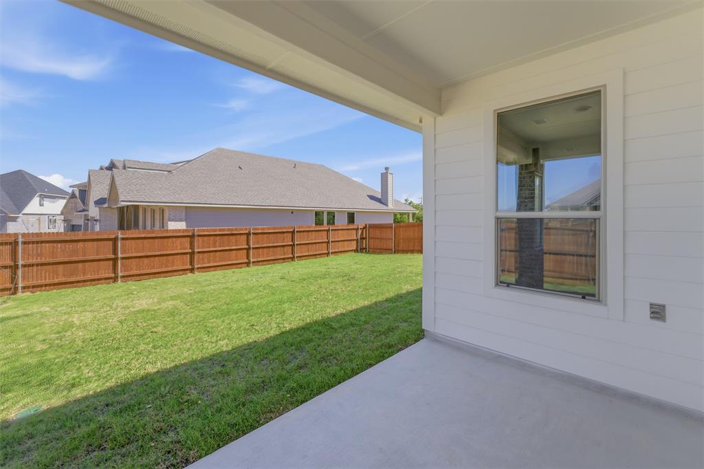 1221 Sabine River Lane Springtown, TX 76082 - Photo 20 of 25 Fenced backyard with a patio area and a residential view