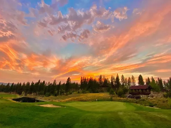 a view of a golf course with a lake