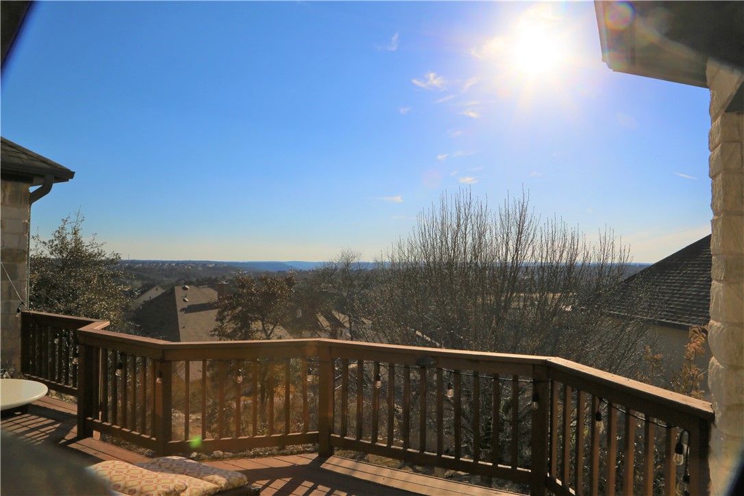 a view of a balcony with city view