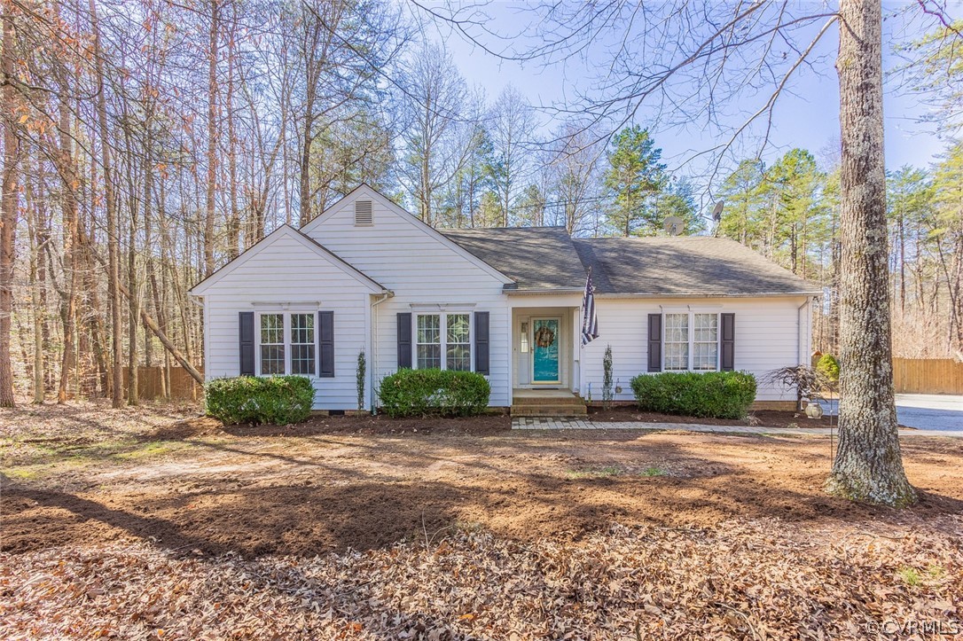 826 Jackson Road Bumpass, VA 23024 - Photo 1 of 26 a front view of a house with a yard and potted plants