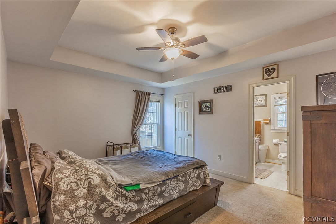 826 Jackson Road Bumpass, VA 23024 - Photo 12 of 26 a bedroom with a bed and a chandelier