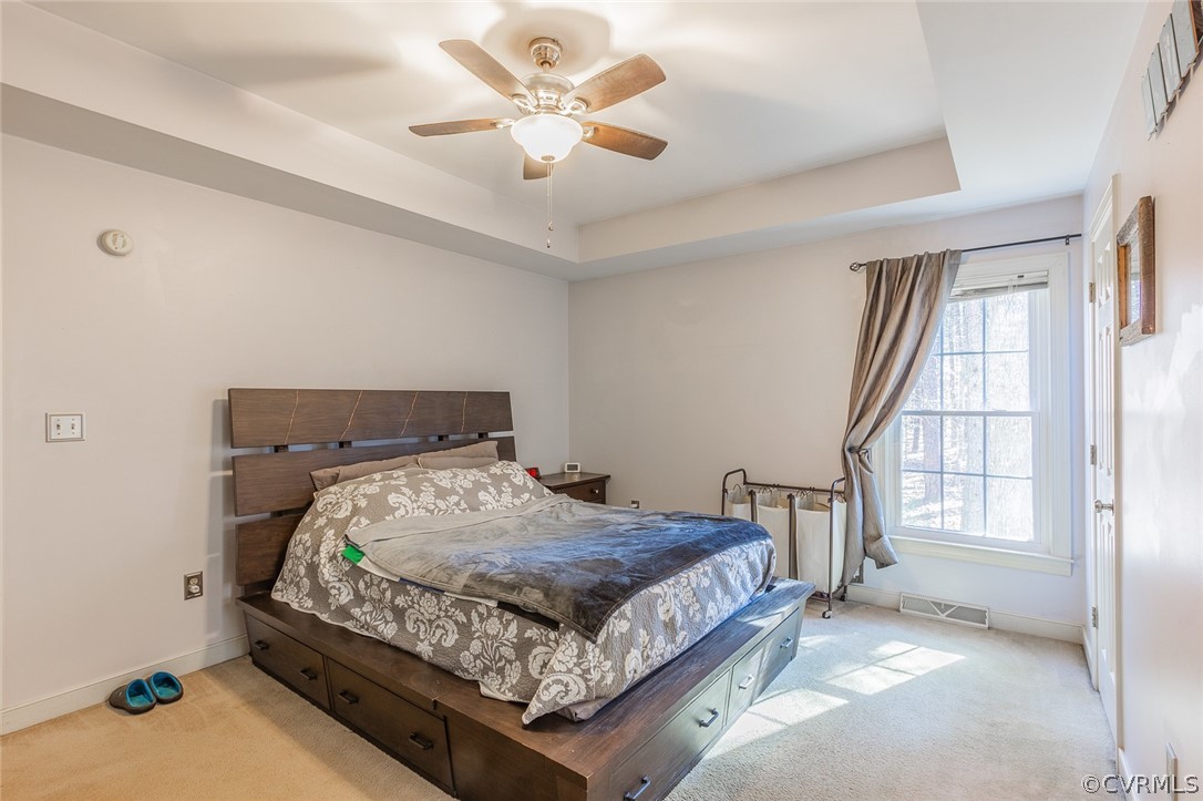 826 Jackson Road Bumpass, VA 23024 - Photo 13 of 26 a bedroom with a bed window and a chandelier