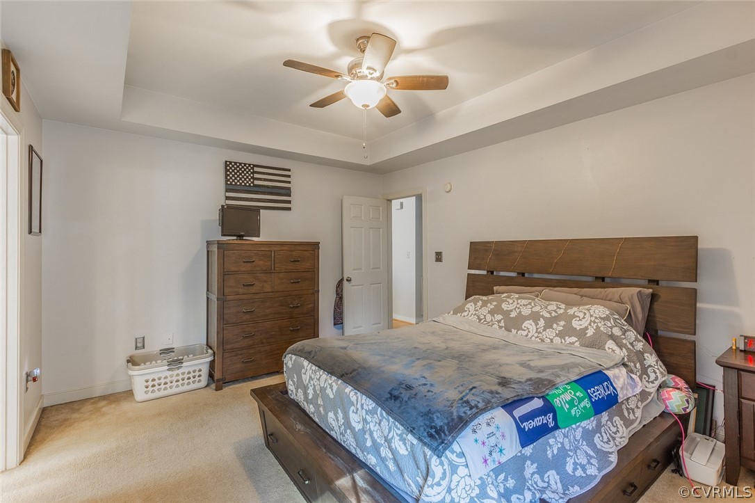 826 Jackson Road Bumpass, VA 23024 - Photo 14 of 26 a bedroom with a bed and a chandelier