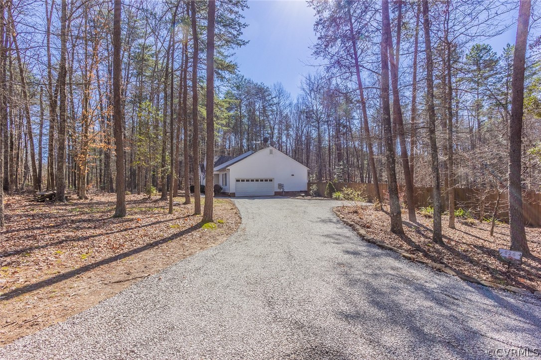 826 Jackson Road Bumpass, VA 23024 - Photo 2 of 26 a view of a backyard with iron fence