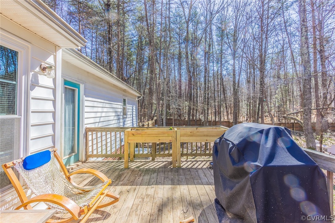 826 Jackson Road Bumpass, VA 23024 - Photo 23 of 26 a view of a balcony with table and chairs
