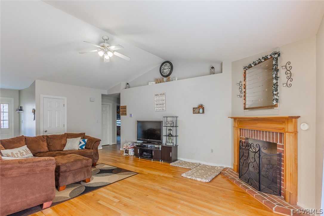 826 Jackson Road Bumpass, VA 23024 - Photo 4 of 26 a living room with furniture a fireplace and a flat screen tv