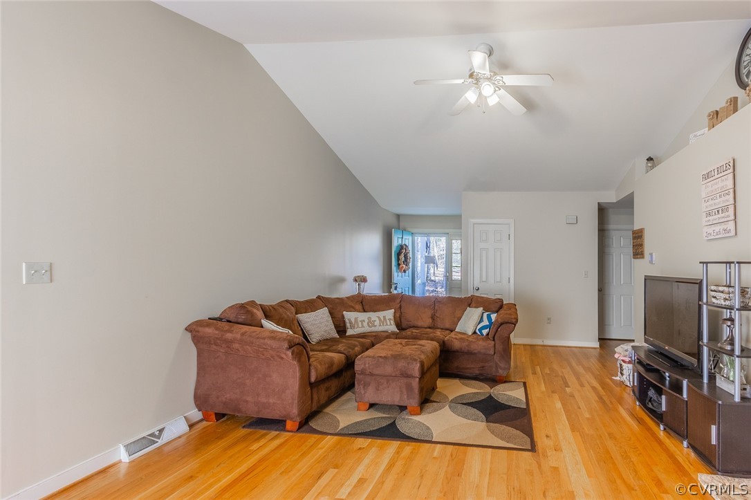 826 Jackson Road Bumpass, VA 23024 - Photo 5 of 26 a living room with furniture and a flat screen tv