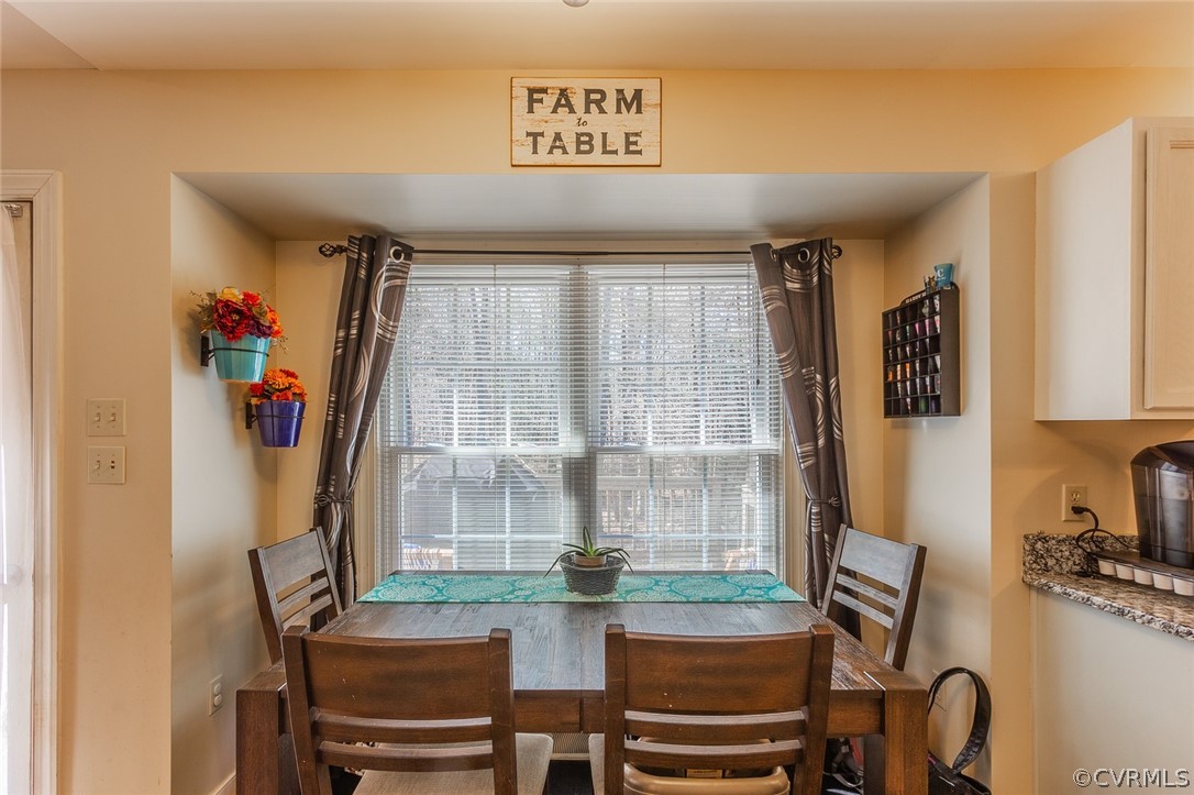 826 Jackson Road Bumpass, VA 23024 - Photo 7 of 26 a view of a dining room with furniture window and outside view