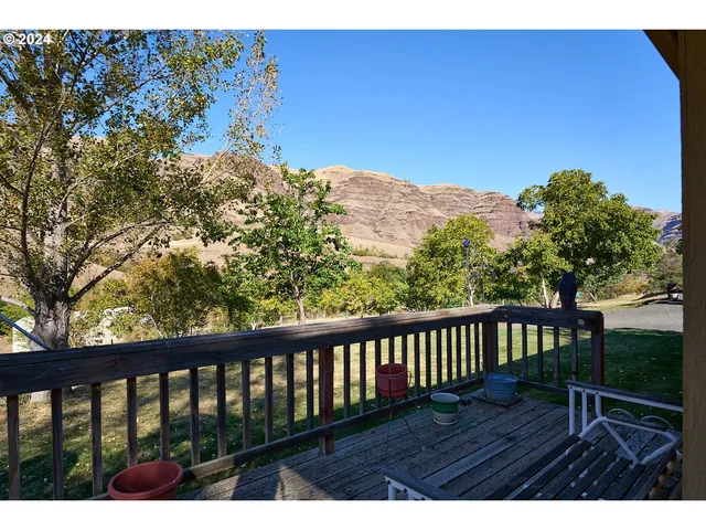 a view of balcony with wooden floor