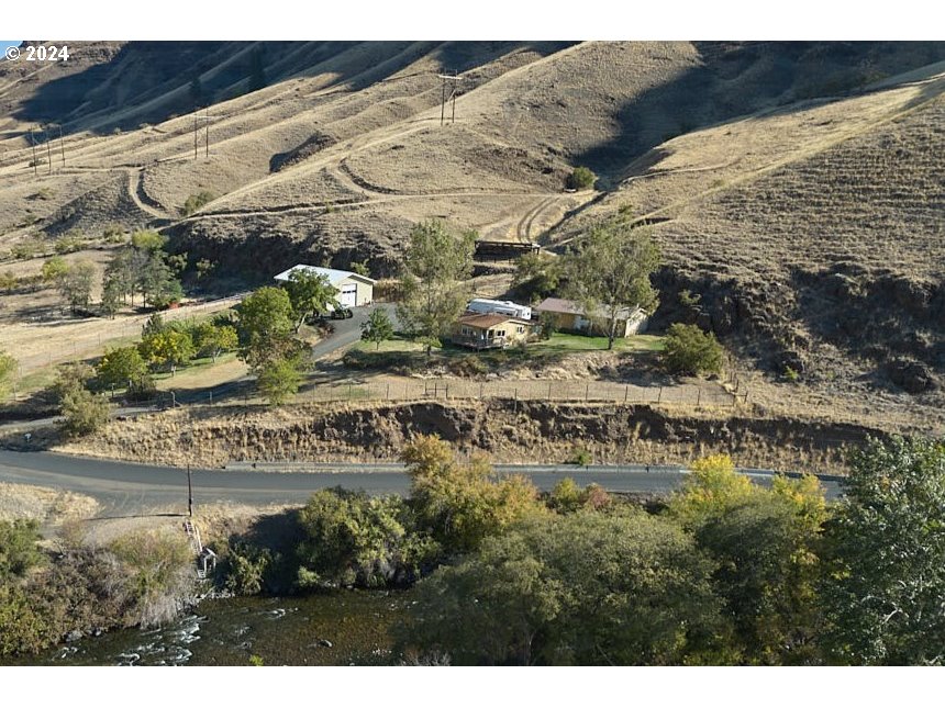 73745 Lower Imnaha Road Imnaha, OR 97842 - Photo 33 of 34 a view of swimming pool with a yard and large tree