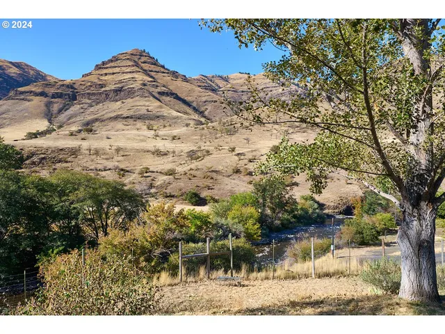 a view of a backyard of a house