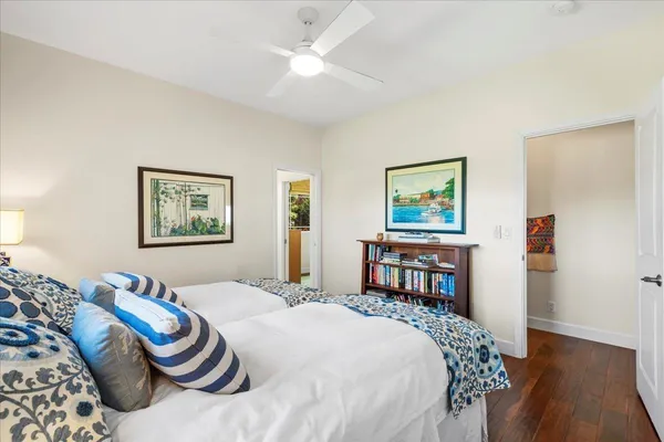 a bedroom with a bed and a table in it