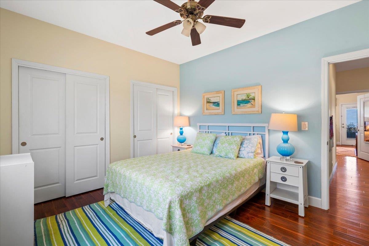 40 Pulehu Road Kula, HI 96790 - Photo 32 of 49 a bedroom with a bed and a chandelier