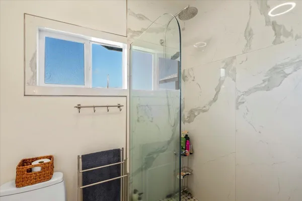 a bathroom with a bathtub and shower