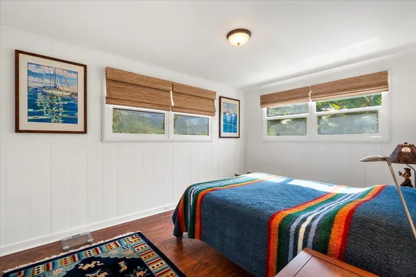 a bedroom with bed and a window