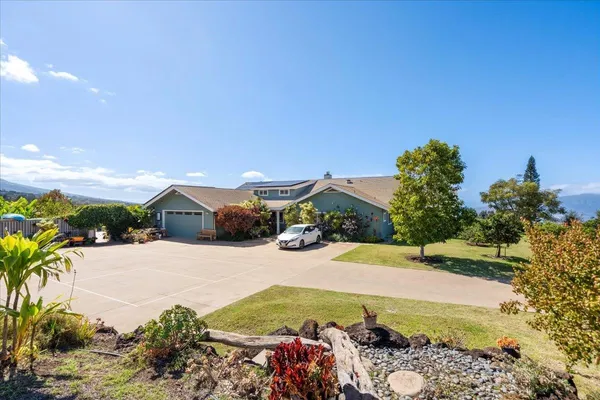 a view of a street with a building in the background