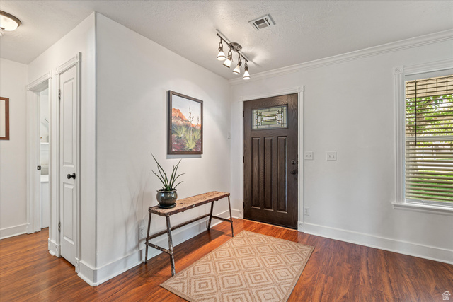 246 West Mount Charm Road Toquerville, UT 84774 - Photo 11 of 70 Entryway featuring wood finished floors, plenty of natural light, and a textured ceiling