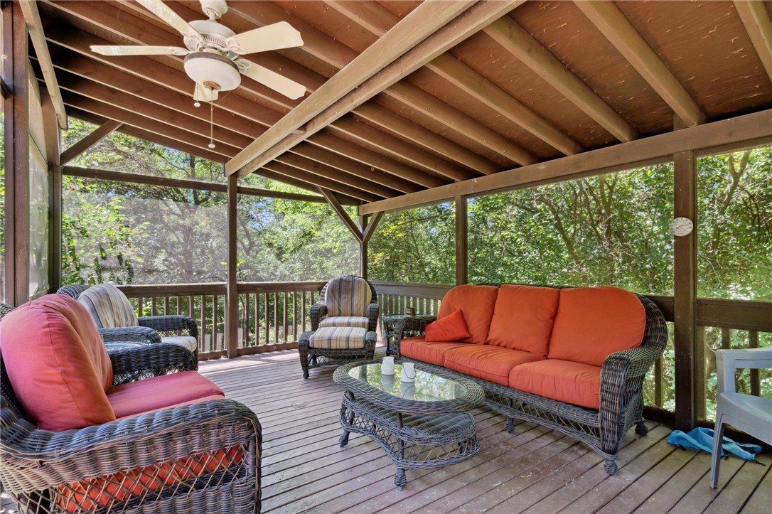 1940 Armstrong Road Fairborn, OH 45324 - Photo 38 of 48 Relax and unwind on this spacious screened porch, offering serene views of surrounding greenery.