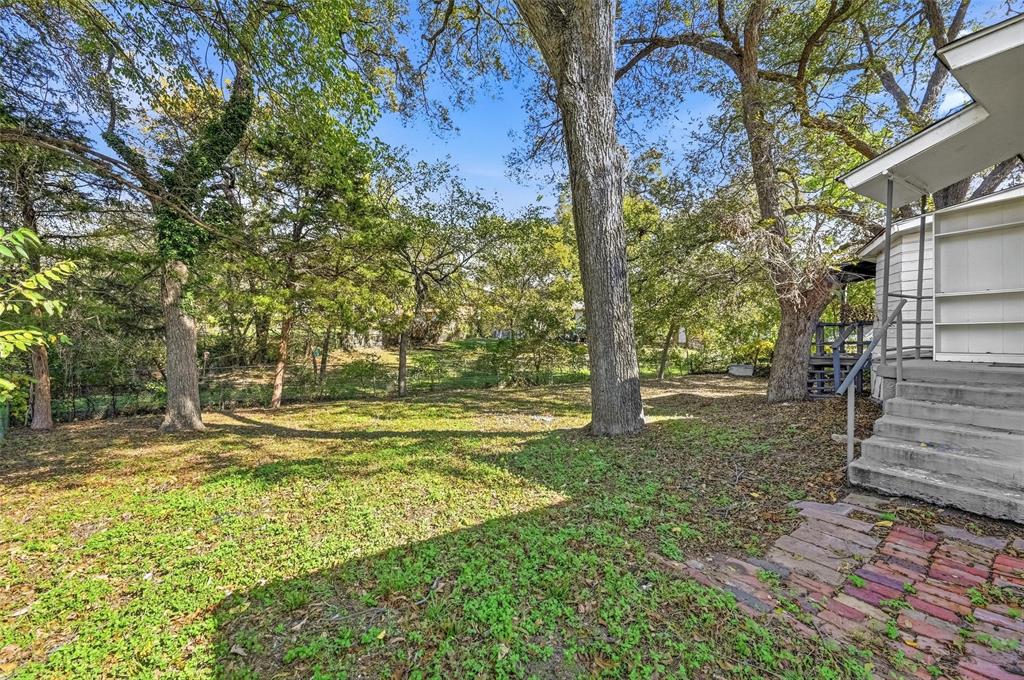 4310 Utah Avenue Dallas, TX 75216 - Photo 12 of 14 a view of a yard with trees