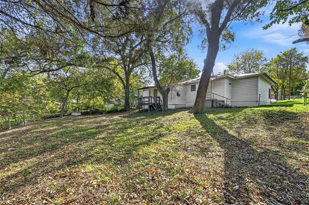 4310 Utah Avenue Dallas, TX 75216 - Photo 13 of 14 a view of a house with a yard