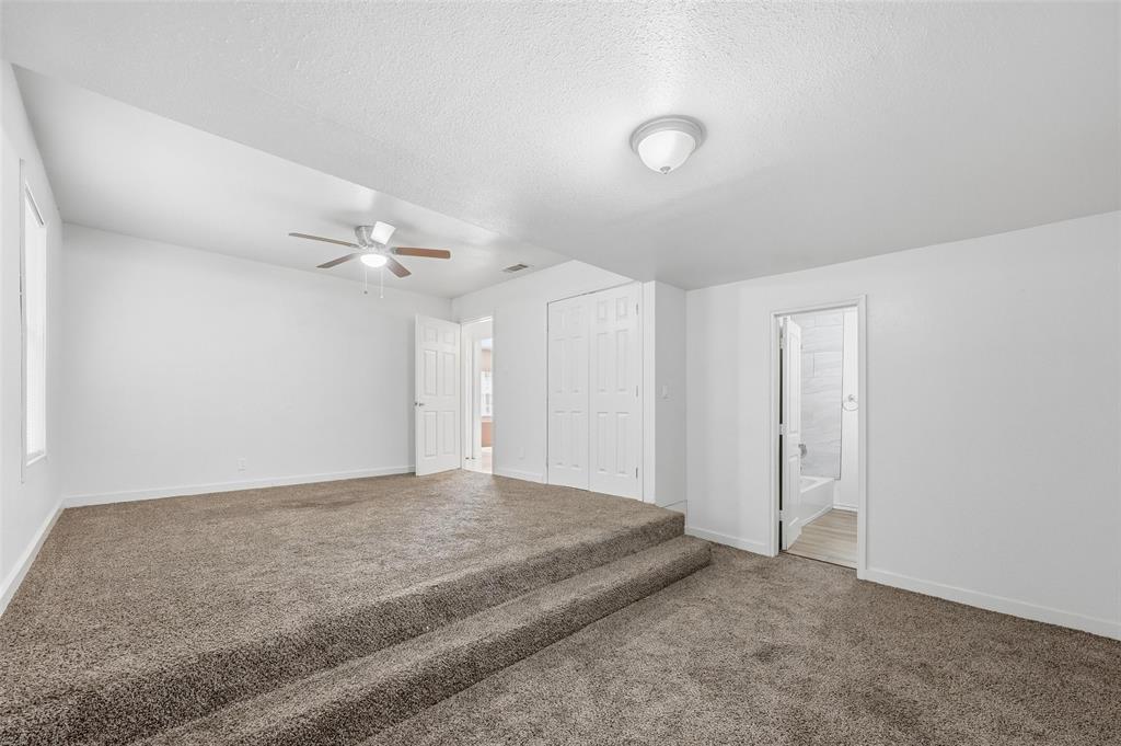 4310 Utah Avenue Dallas, TX 75216 - Photo 4 of 14 a view of a livingroom with a ceiling fan and window