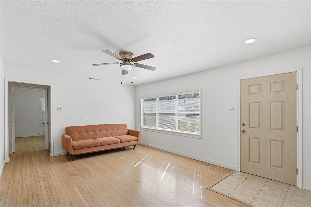 4310 Utah Avenue Dallas, TX 75216 - Photo 7 of 14 a living room with furniture and a window