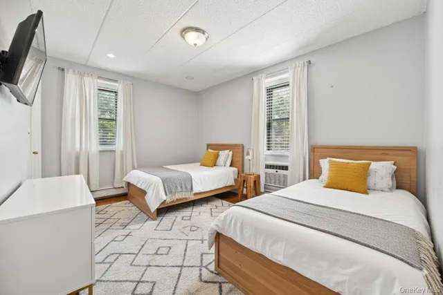 a bedroom with a large bed and a couch