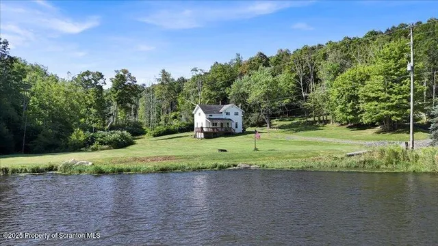a view of a fountain in front of a house