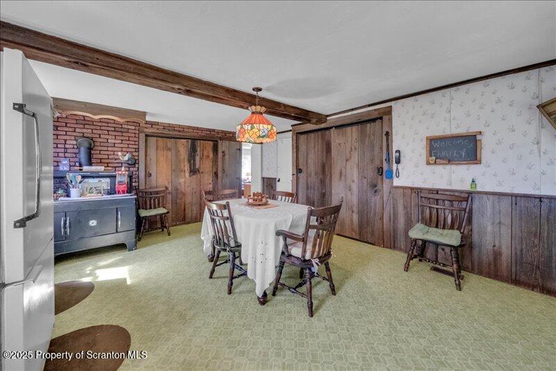 10846 Forest Lake Road Montrose, PA 18801 - Photo 15 of 42 a dining room with furniture and a rug