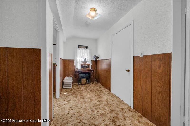 10846 Forest Lake Road Montrose, PA 18801 - Photo 20 of 42 a view of a hallway with workspace and closet area