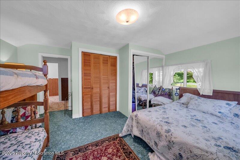 10846 Forest Lake Road Montrose, PA 18801 - Photo 25 of 42 a bed room with a bed and a window