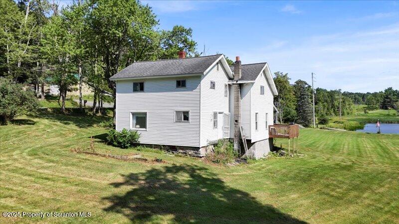 10846 Forest Lake Road Montrose, PA 18801 - Photo 30 of 42 a house view with a garden space