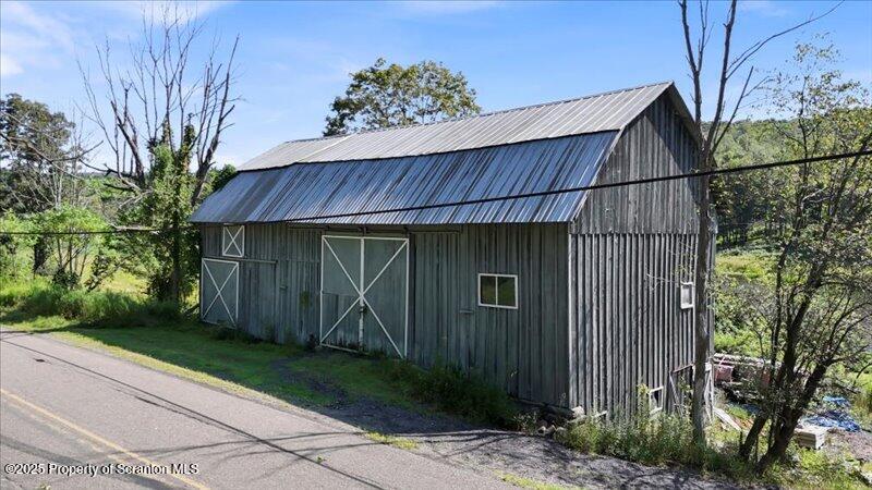 10846 Forest Lake Road Montrose, PA 18801 - Photo 33 of 42 a backyard of a house with lots of green space
